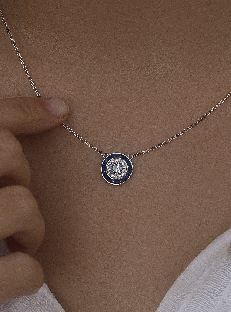 Necklaces with circular design stones in a blue tone