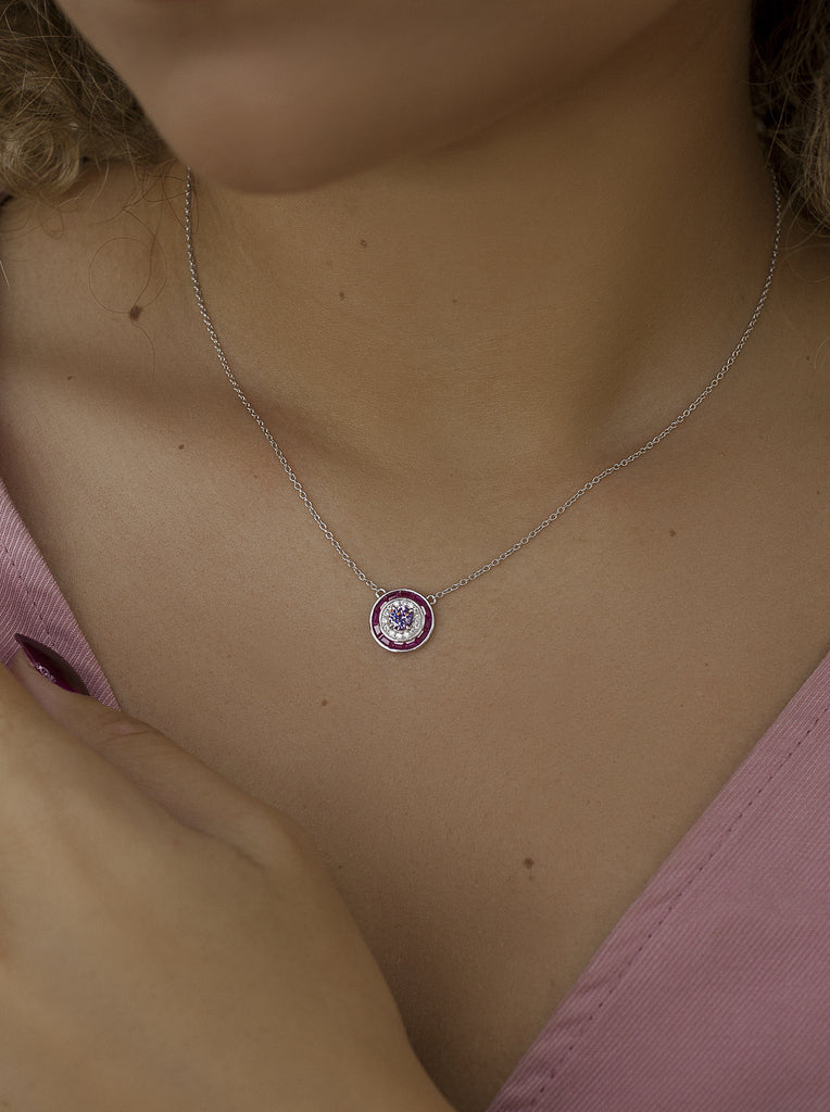 Necklaces with circular design stones in a fuchsia tone