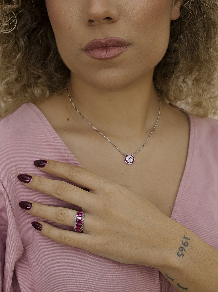Necklaces with circular design stones in a fuchsia tone