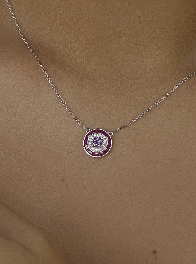 Necklaces with circular design stones in a fuchsia tone
