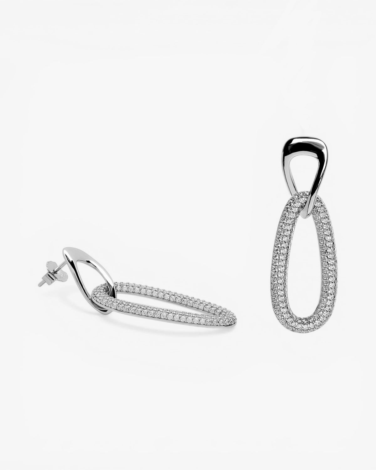 Long silver earrings with cubic zirconia link design