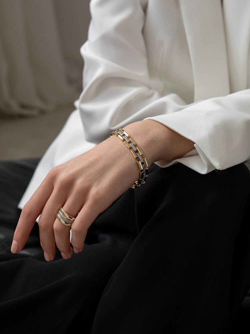 Two-tone silver ring with a textured pattern and cubic zirconia