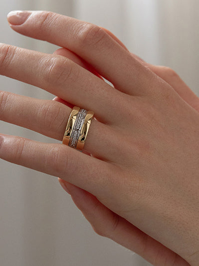 Two-tone silver ring with a textured pattern and cubic zirconia