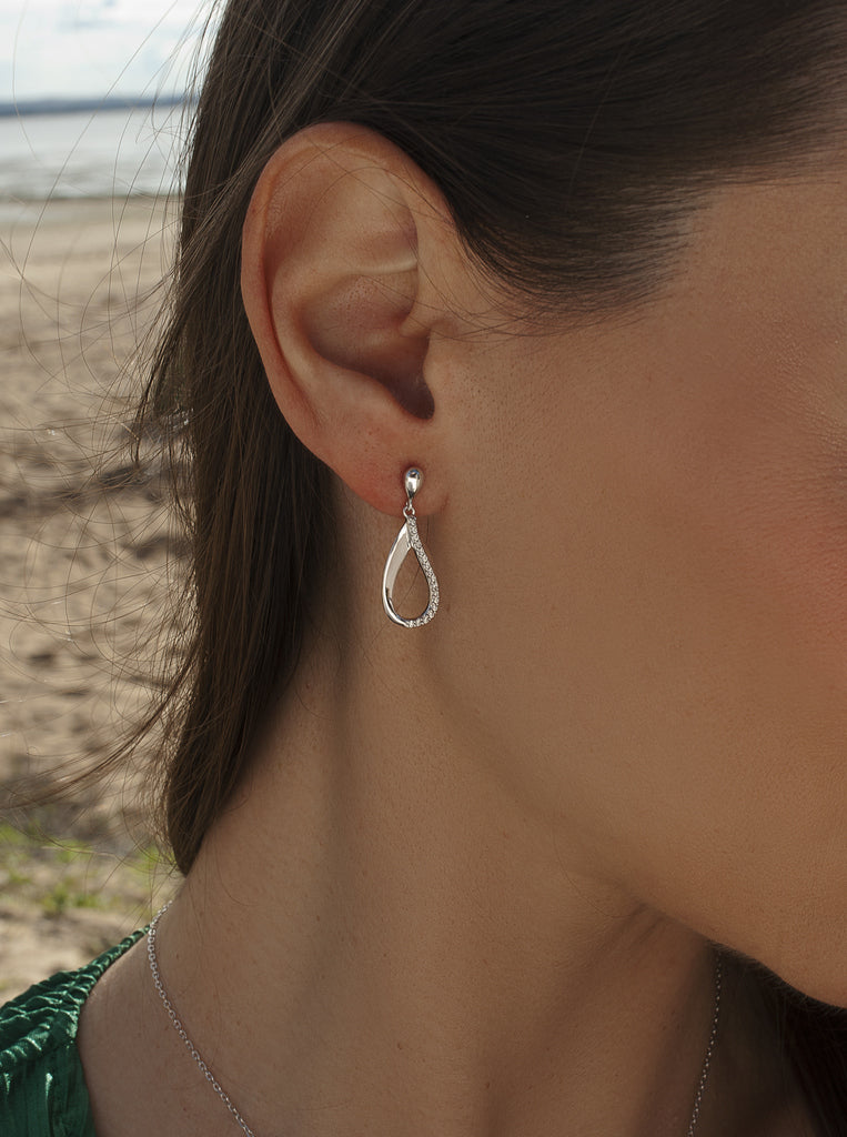 Long, minimalist silver earrings with cubic zirconia