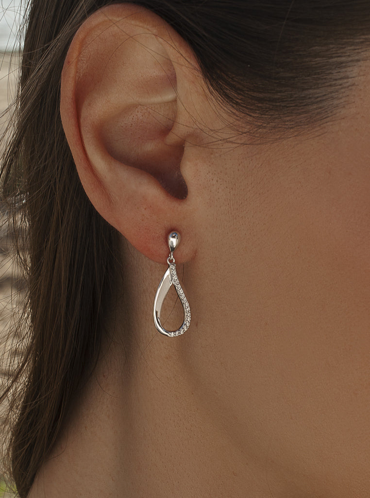Long, minimalist silver earrings with cubic zirconia