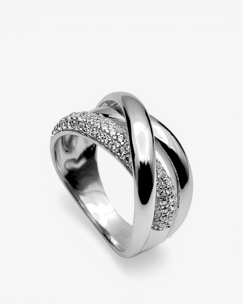 Wide silver ring crossed with cubic zirconia