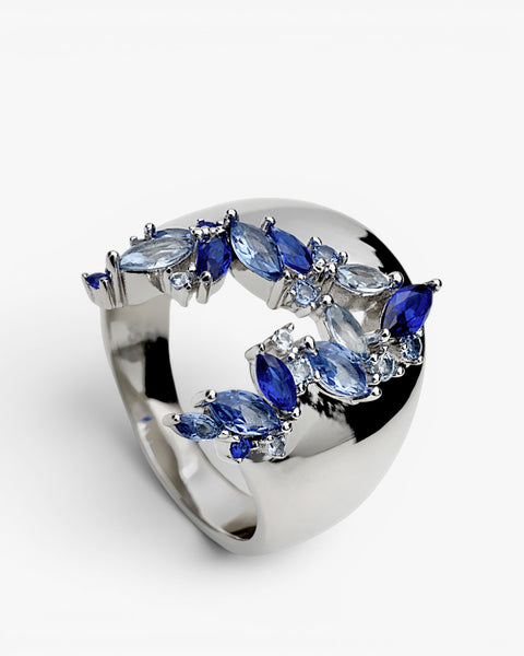 Colorful gemstone ring in blue tones with floral inspiration