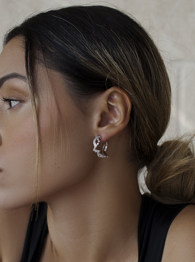Zigzag knot-style hoop earrings with cubic zirconia