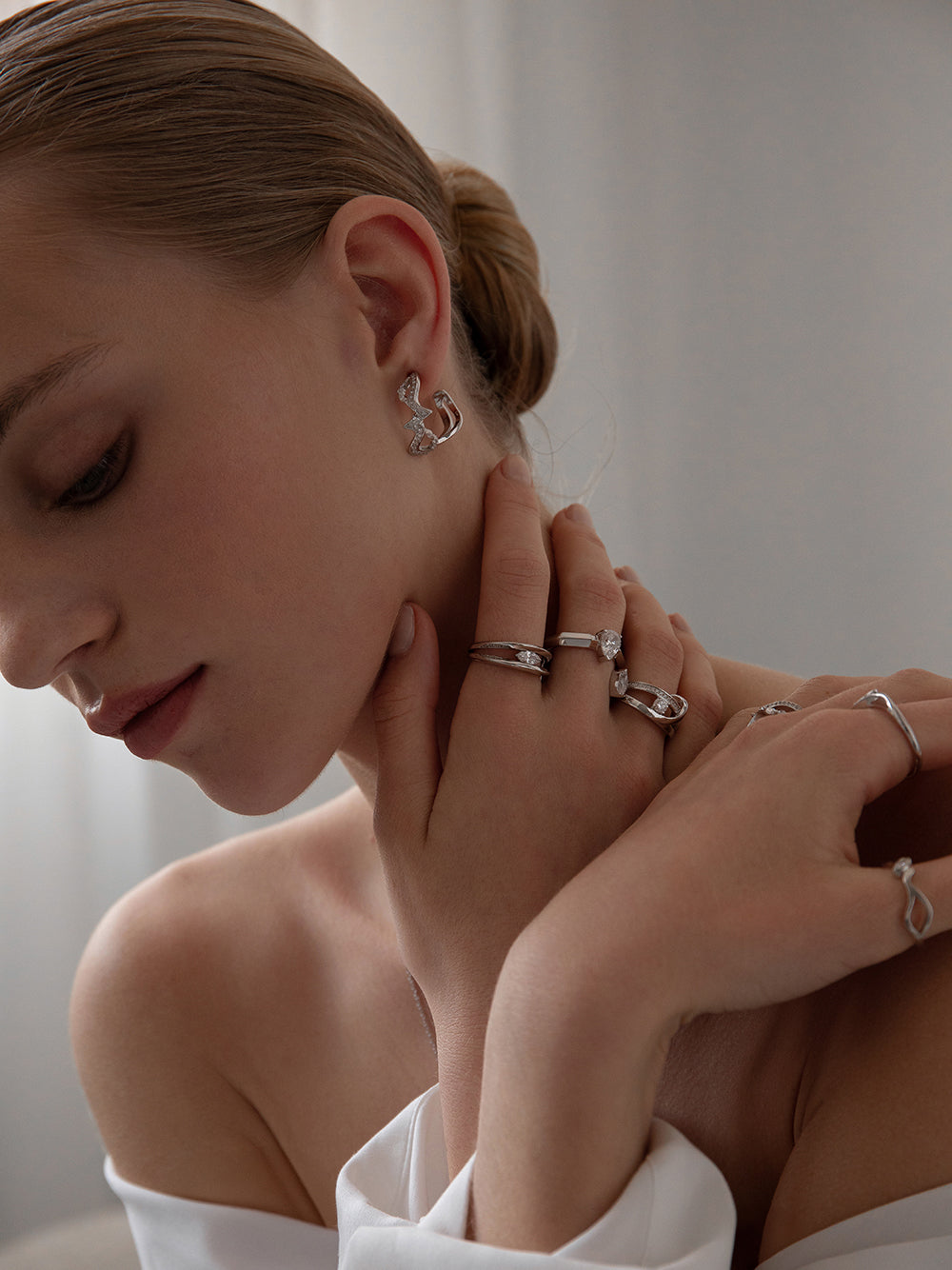 Zigzag knot-style hoop earrings with cubic zirconia