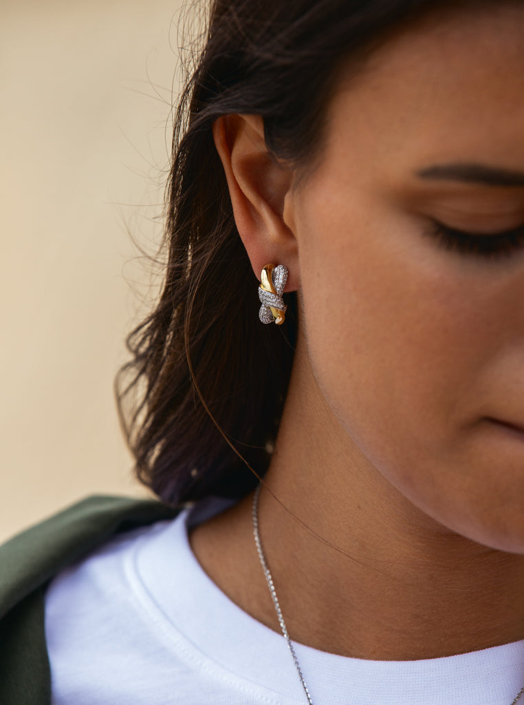 Two-tone earrings linked with a knot and cubic zirconia