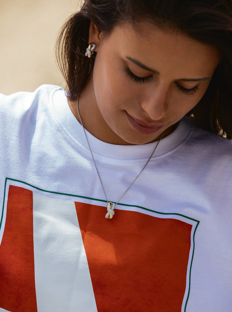 Two-tone necklace linked with a knot and cubic zirconia