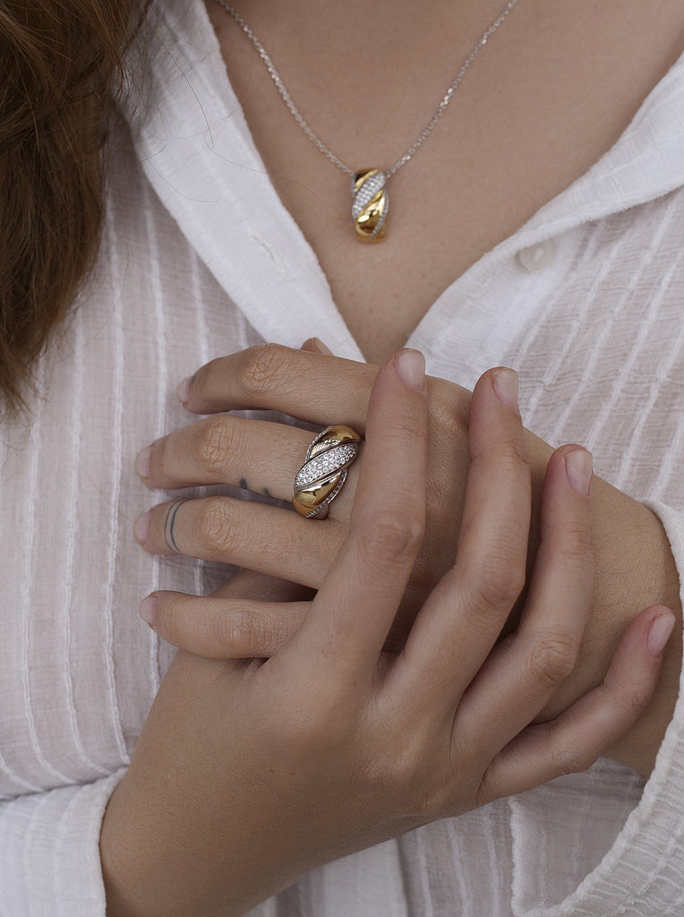 Two-tone braided silver and gold ring with cubic zirconia