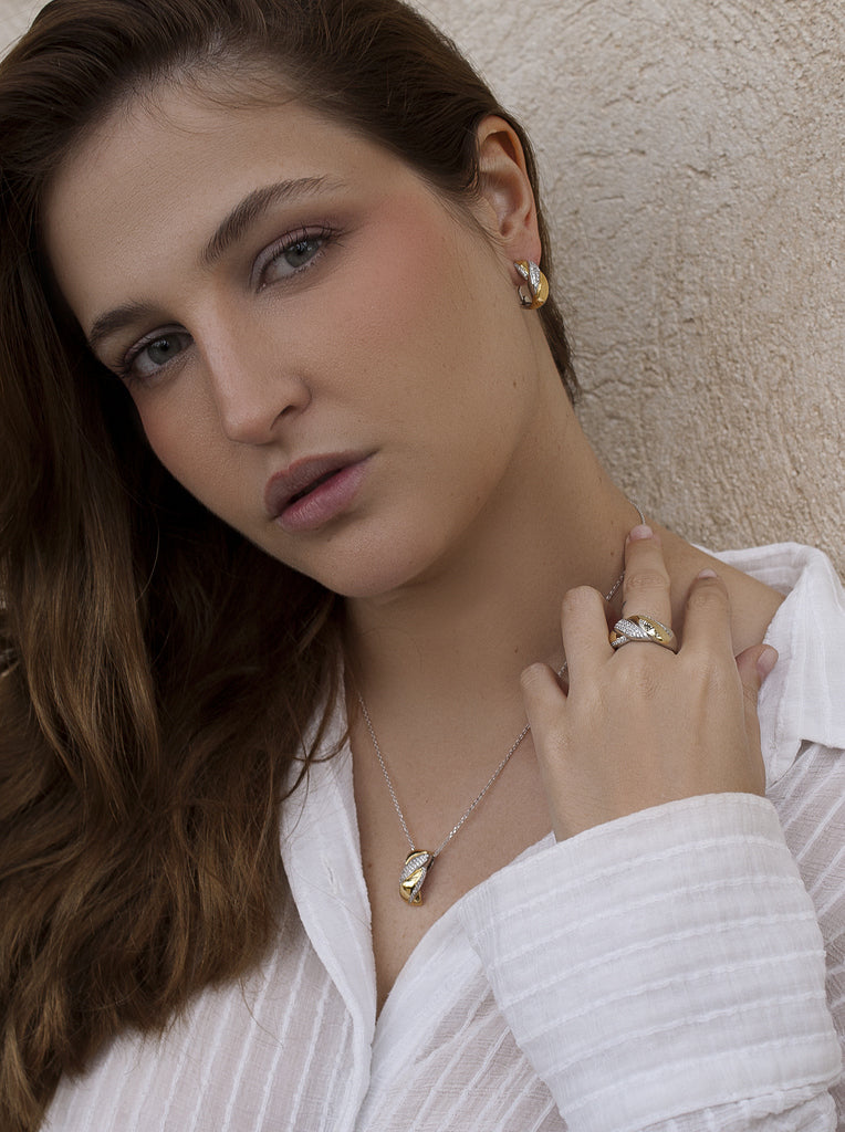 Two-tone braided silver and gold ring with cubic zirconia