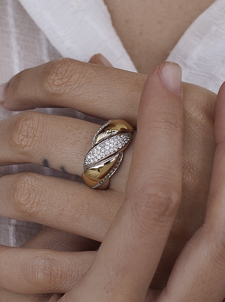 Two-tone braided silver and gold ring with cubic zirconia