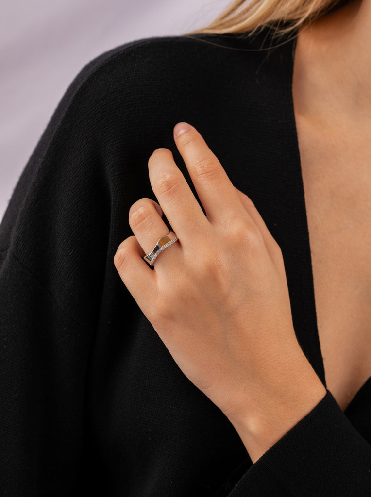 Wide, irregular silver ring with a line of cubic zirconia