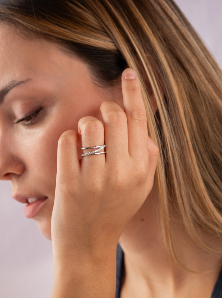 Ring with triple central rails and cubic zirconia
