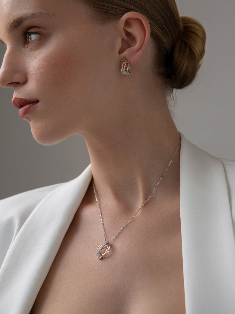 Two-tone silver necklace with intertwined cubic zirconia