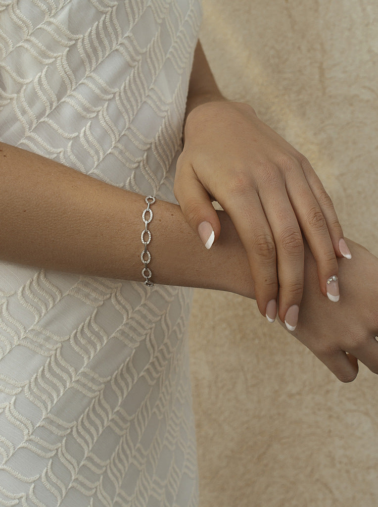 Silver link bracelets with oval-shaped cubic zirconia