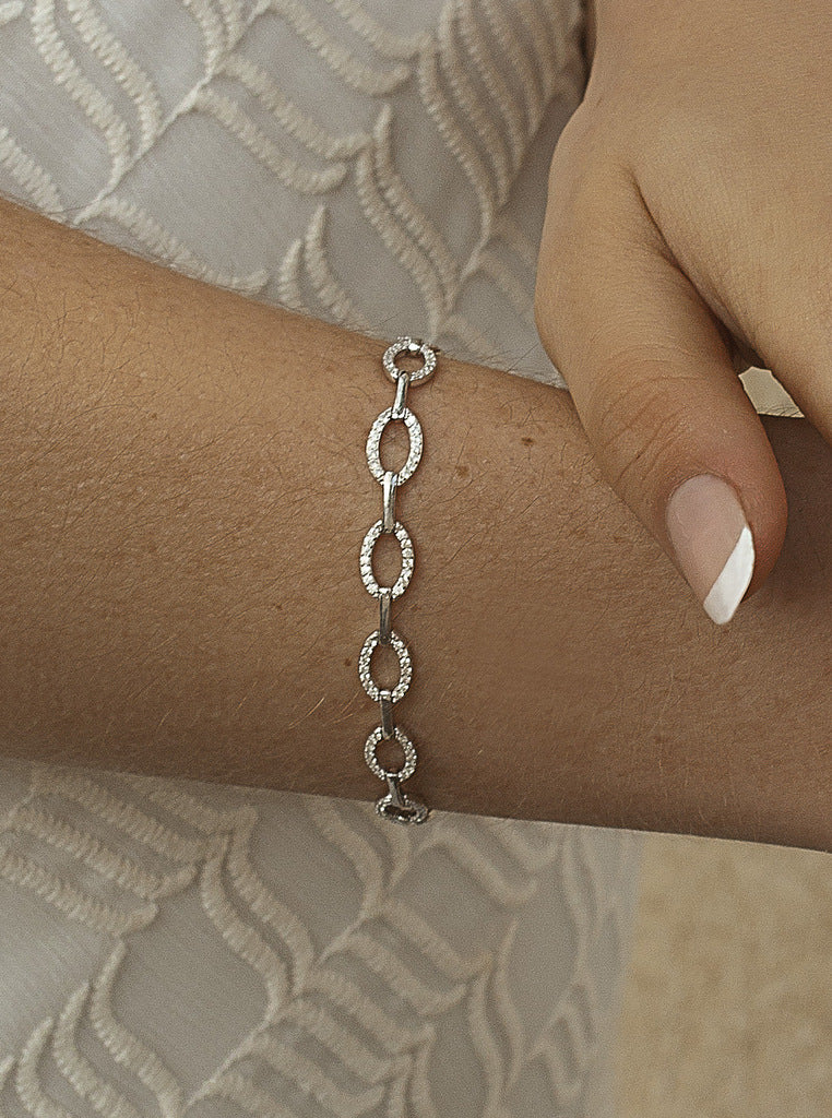Silver link bracelets with oval-shaped cubic zirconia