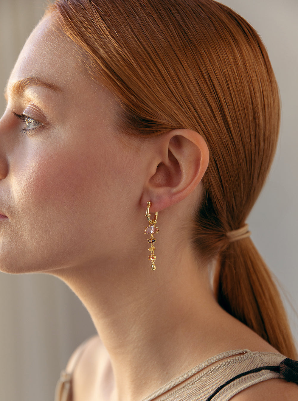 Silver earrings with colored stones in shades of brown and pink