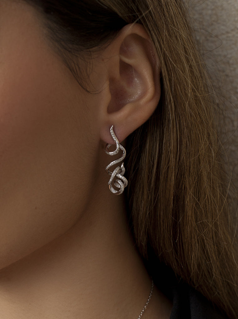 Long, tangled earrings with cubic zirconia