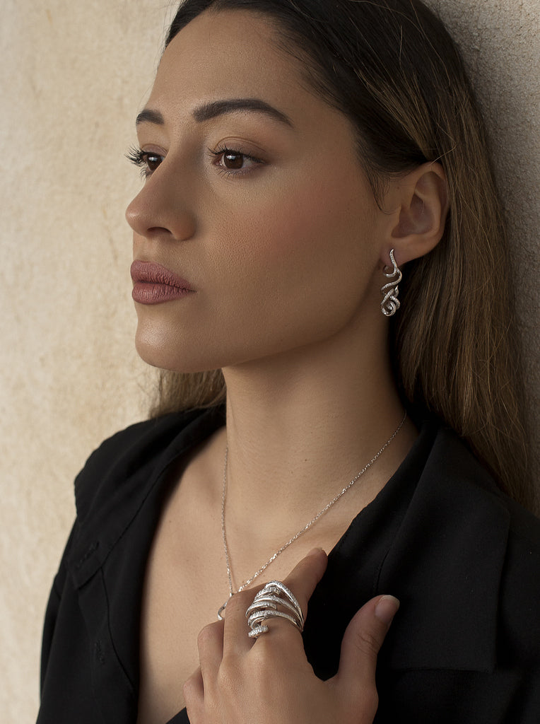 Long, tangled earrings with cubic zirconia