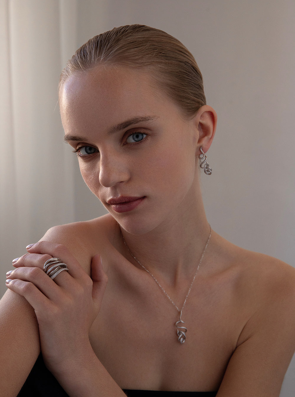 Long, tangled earrings with cubic zirconia