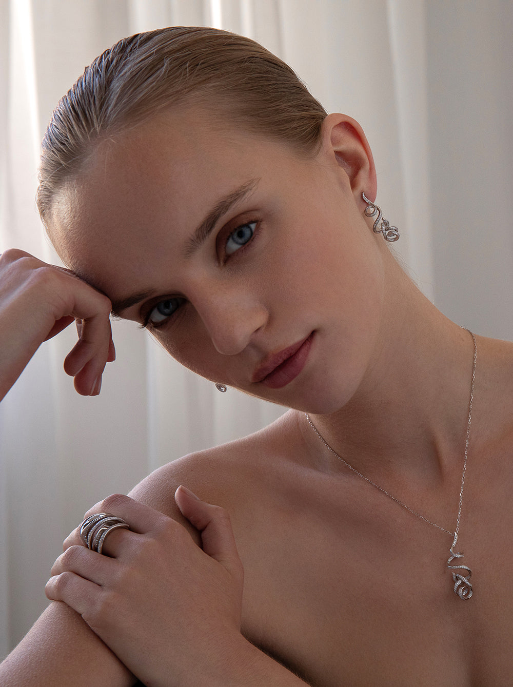 Long, tangled earrings with cubic zirconia