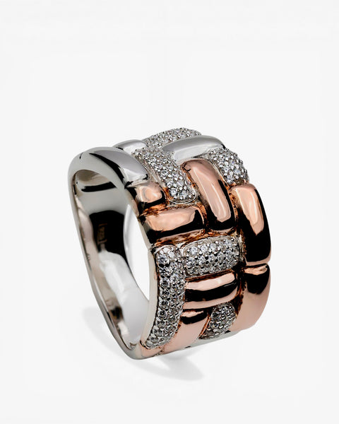 Two-tone silver ring in a woven style with cubic zirconia