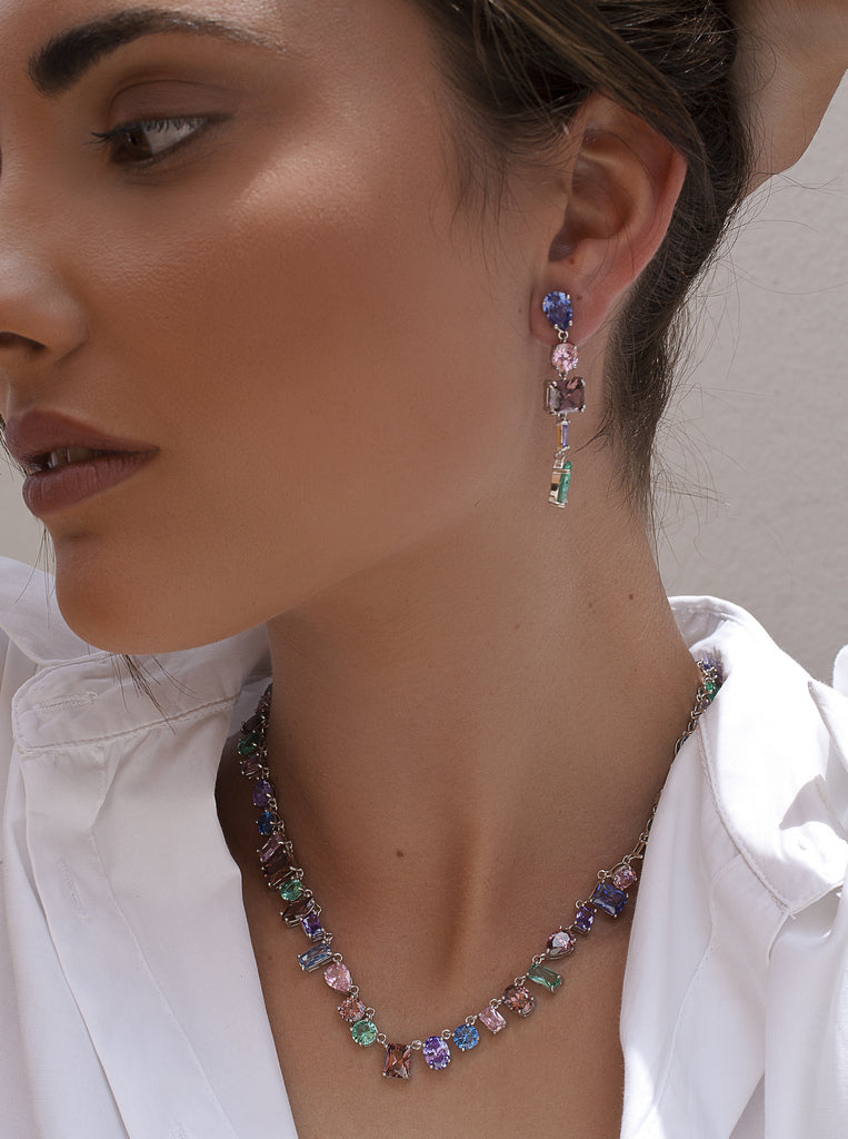 Necklaces with multicolored stones in a geometric design.