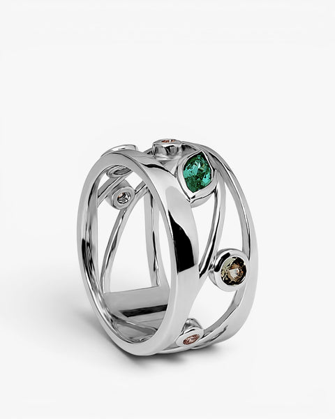 Crisscross silver ring with green and champagne zircons