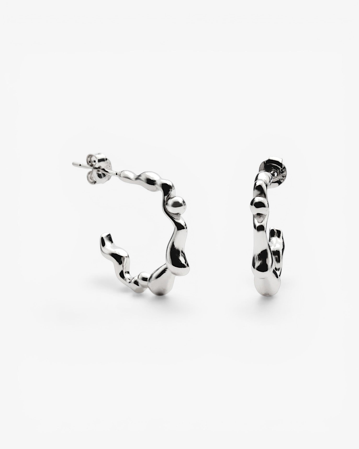irregular puffy silver hoop earrings