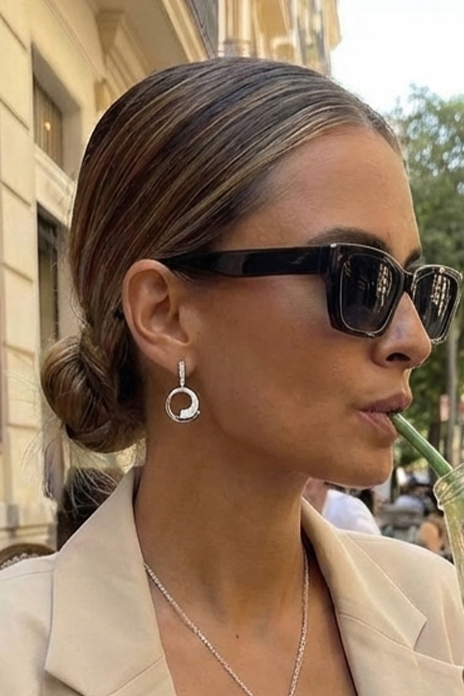 Silver dangle earrings with circular design cubic zirconia