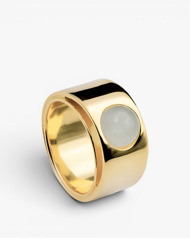 Wide gold-plated silver ring with a cabochon blue stone