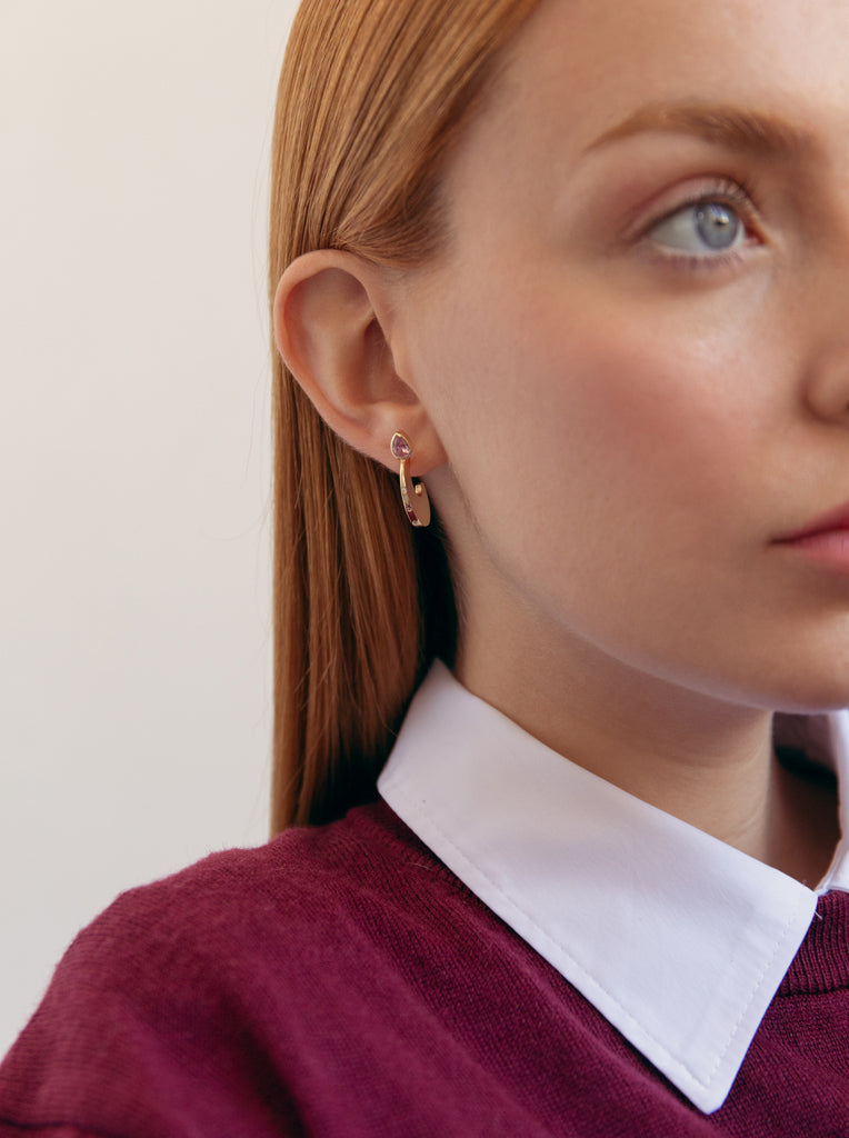 Silver earrings with gold plating, a pink drop-shaped stone, and cubic zirconia
