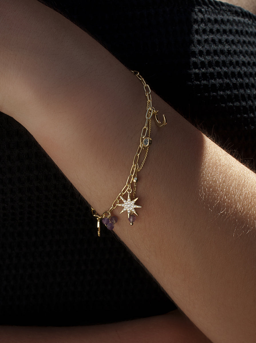Gilded 925 sterling silver North Star bracelet with lilac stone charms and a blue detail