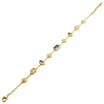 Pulsera fina de plata bañada en oro con piedras azules y brillo