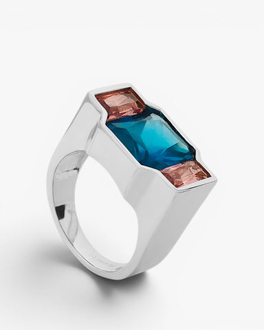 Anillo de plata 925 con piedra azul y detalles rosa