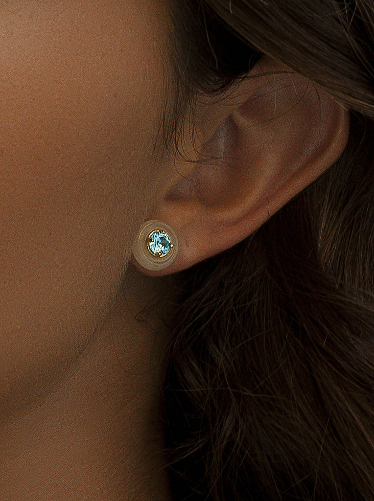 Gold stud earrings with mother-of-pearl and turquoise disc