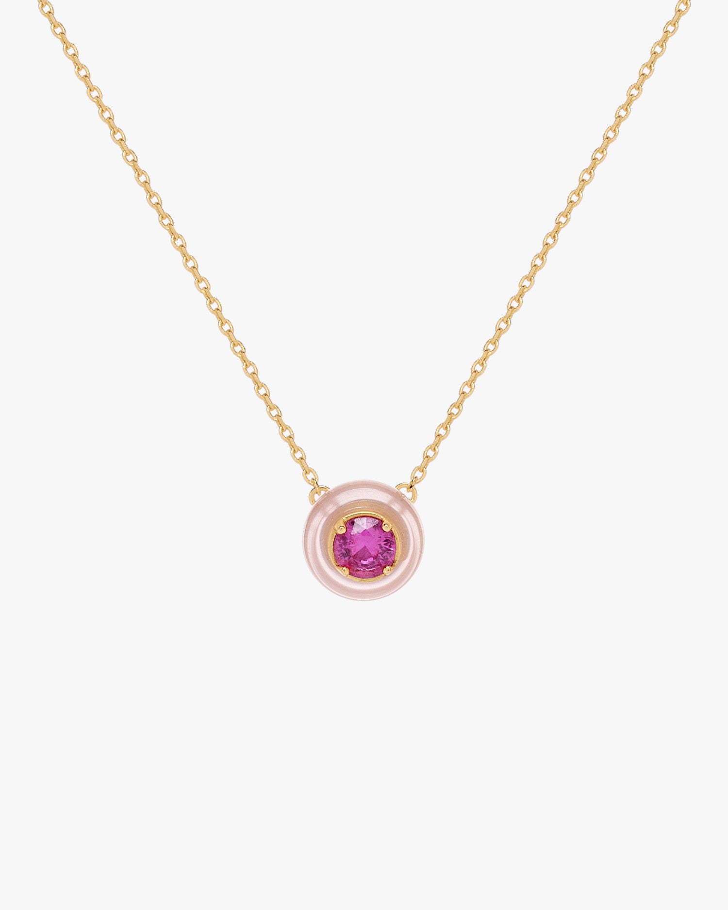Gold necklace with pink disc pendant and fuchsia zirconia