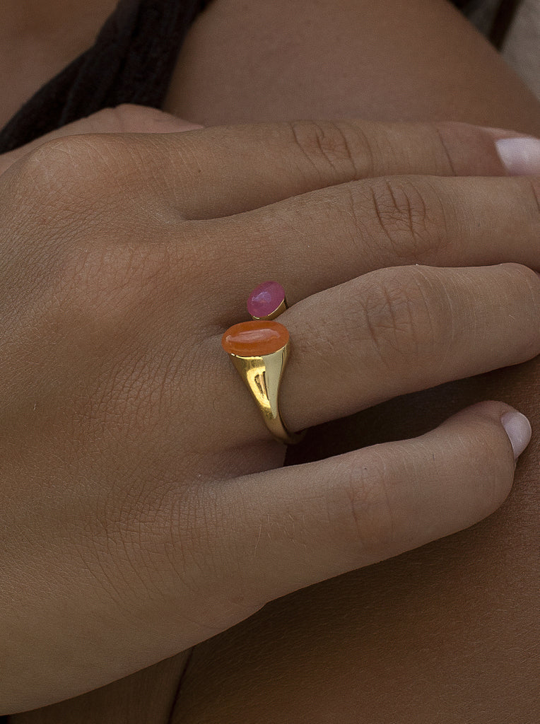 Open gold-tone silver ring with pink and orange stones