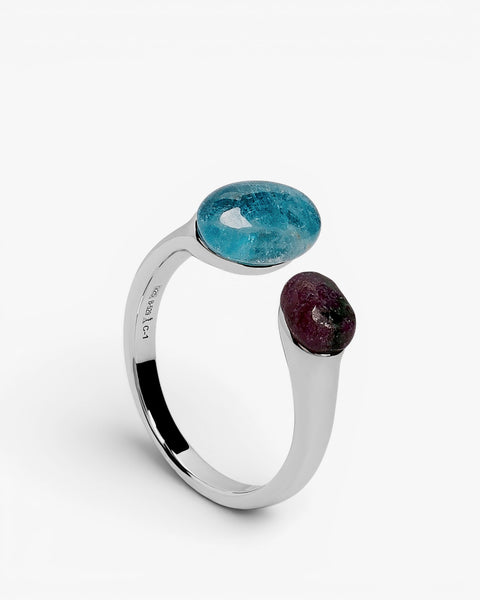 Open sterling silver ring with green and blue cabochon stones