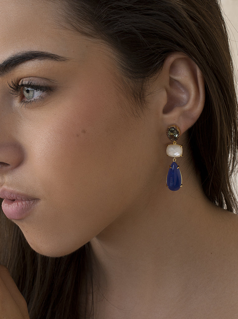 Long gilded silver earrings with blue, white and green stones