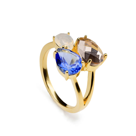Anillo de plata acabado dorado con triple piedra azul  blanco y champagne