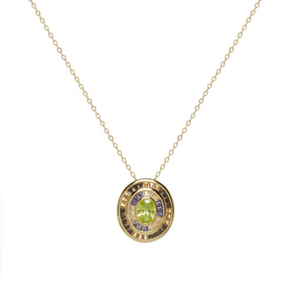 Collar con colgante halo circular y circonitas verdes con toques cálidos. plata bañada en oro para iluminar cualquier outfit.
