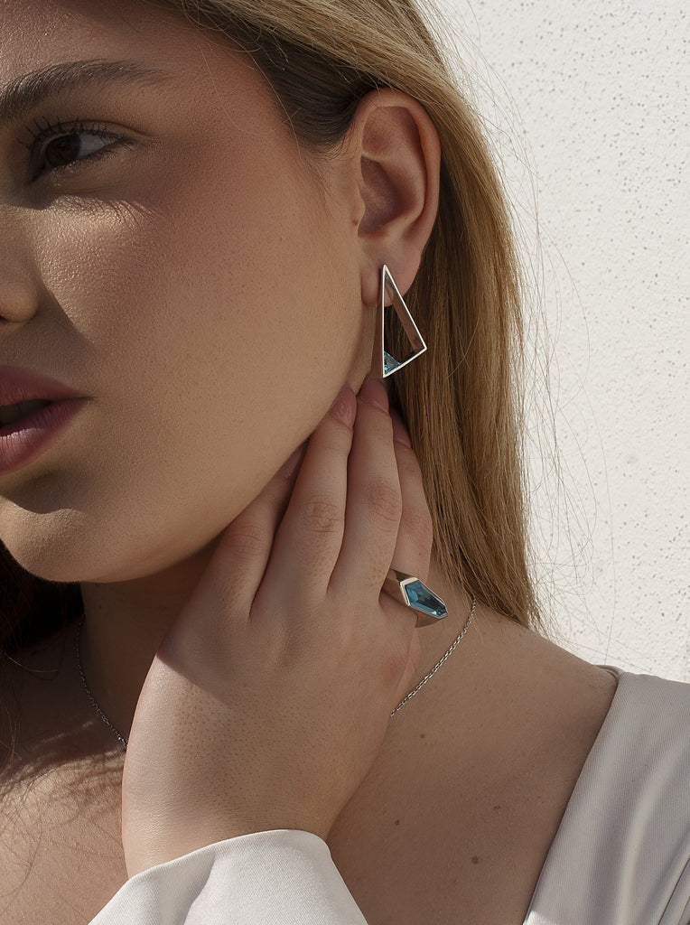 Geometric triangular silver earrings with blue stone
