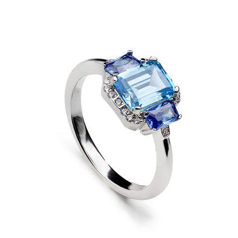 Anillo de plata con piedras azules talla esmeralda