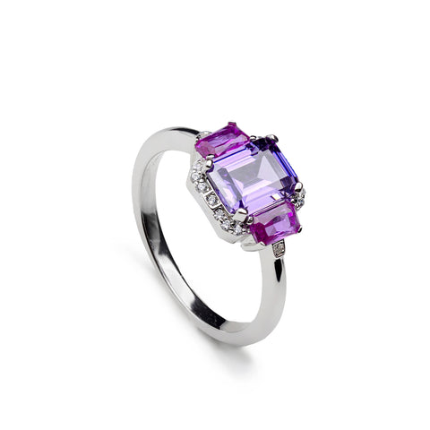 Anillo de plata con piedra lila y piedras fucsia