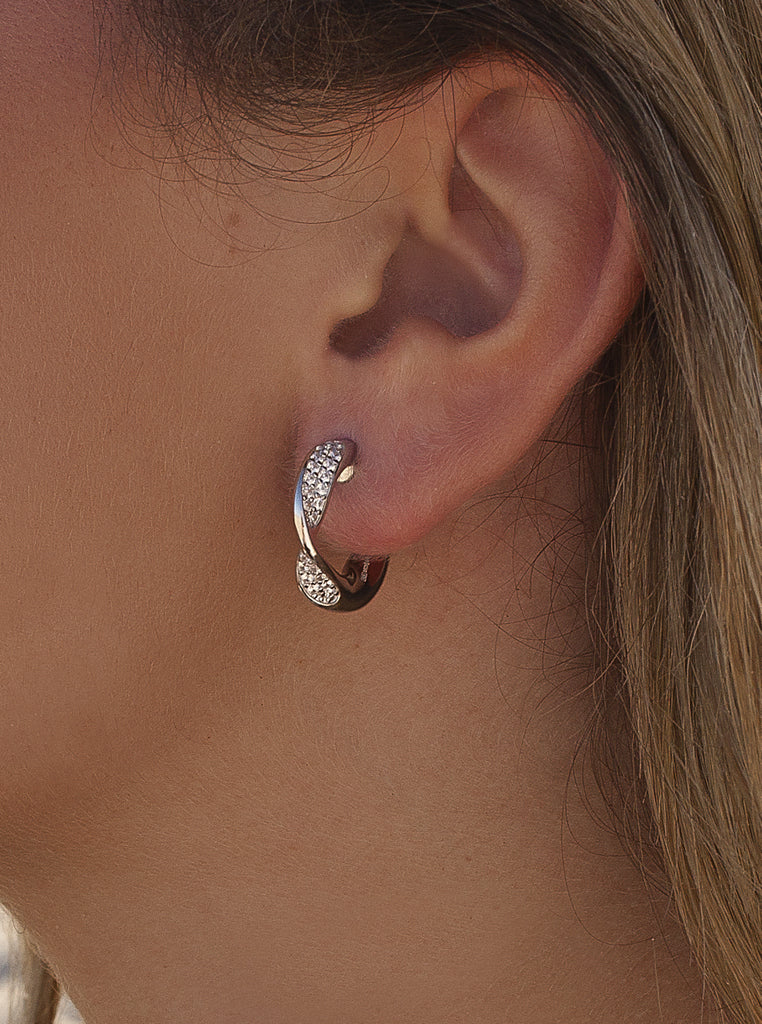 Silver earrings with cubic zirconia and a wavy design
