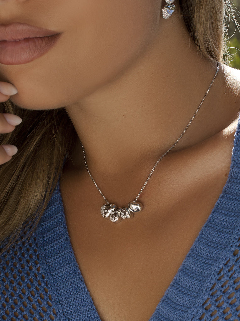 Collar de plata con piezas orgánicas y circonitas